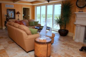 A living room with brown couches and orange interiors.